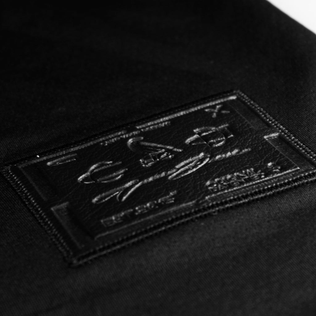 Black mint jersey by Crowdead. Side engraved label closeup.