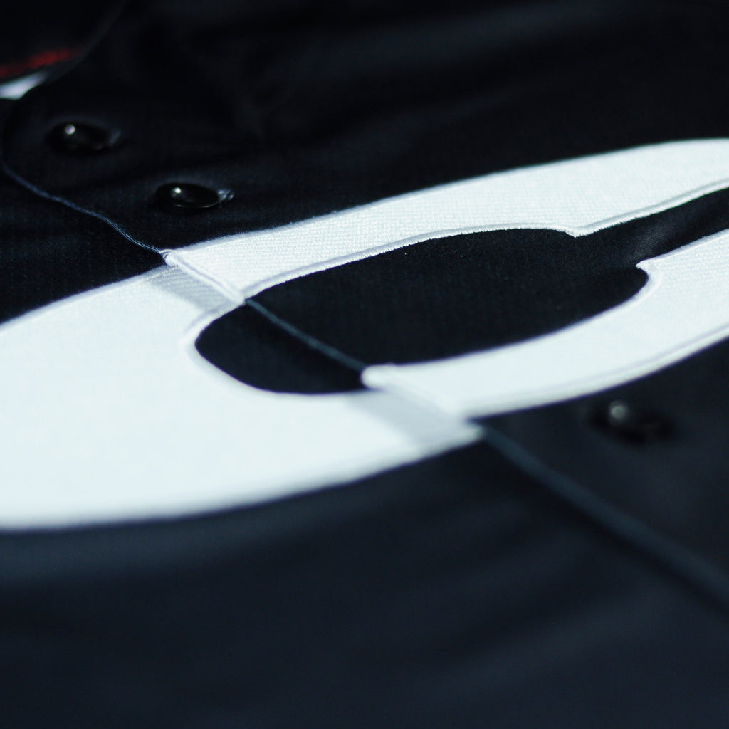 Ice jersey by Crowdead. Front C embroidery closeup.