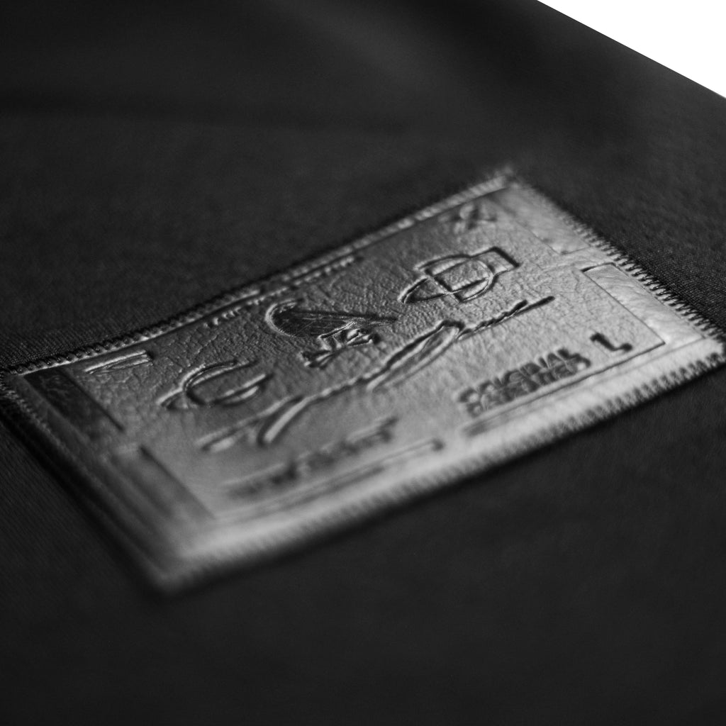 The new gold jersey by Crowdead. Side label engraved on black leather closeup.