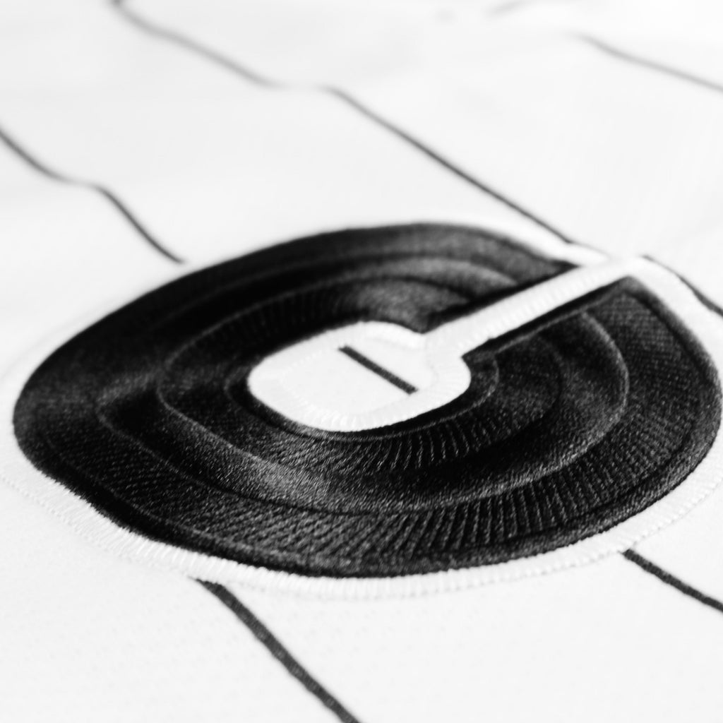 Referee volume 2 jersey by Crowdead. Front C embroidered logo closeup.