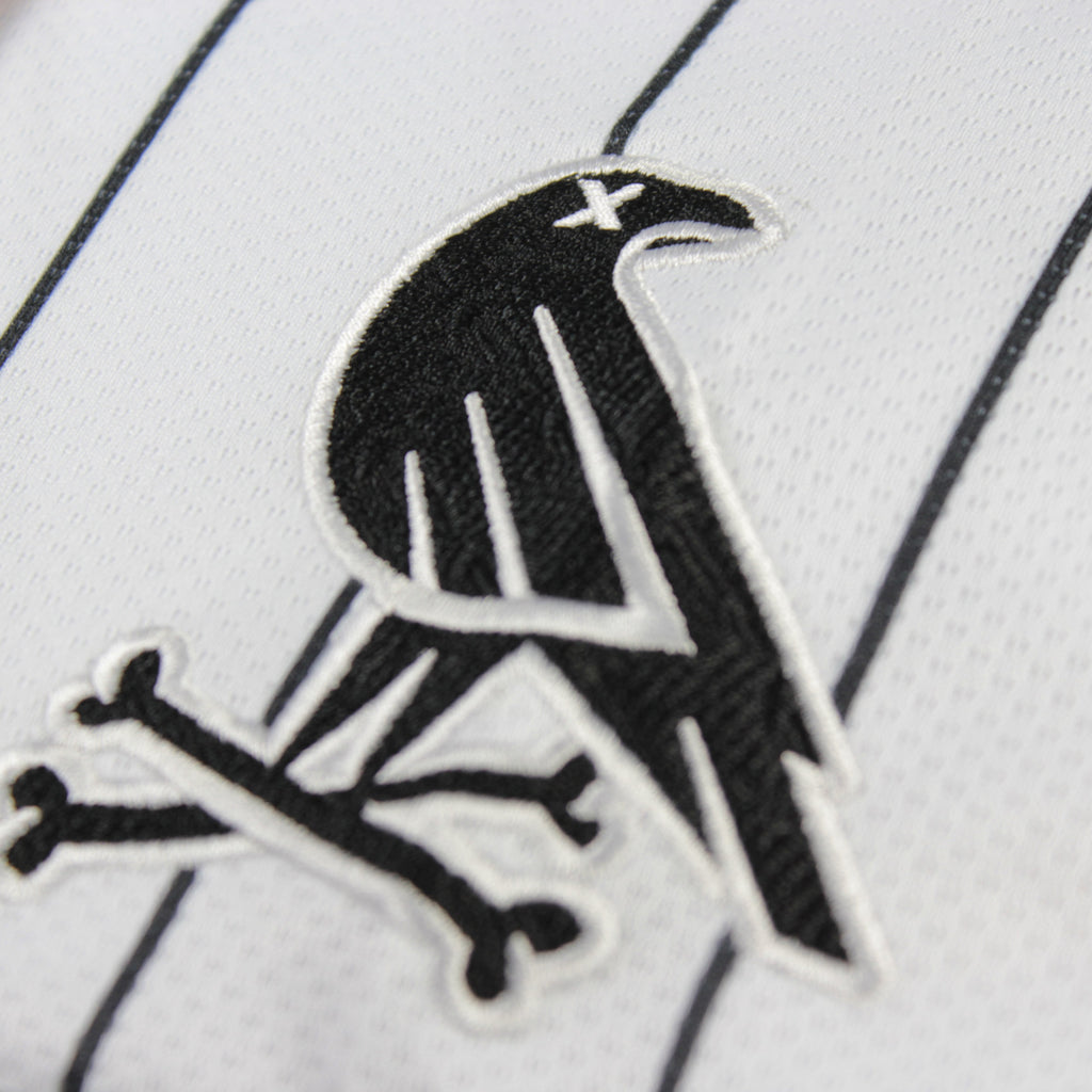 Referee volume 2 jersey by Crowdead. Sleeve Crow & Crossbones embroidered logo closeup.