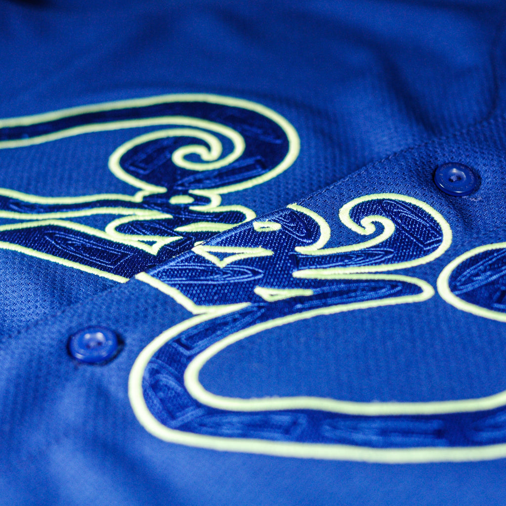 Closeup of front logo on Super Blue jersey by Crowdead streetwear.