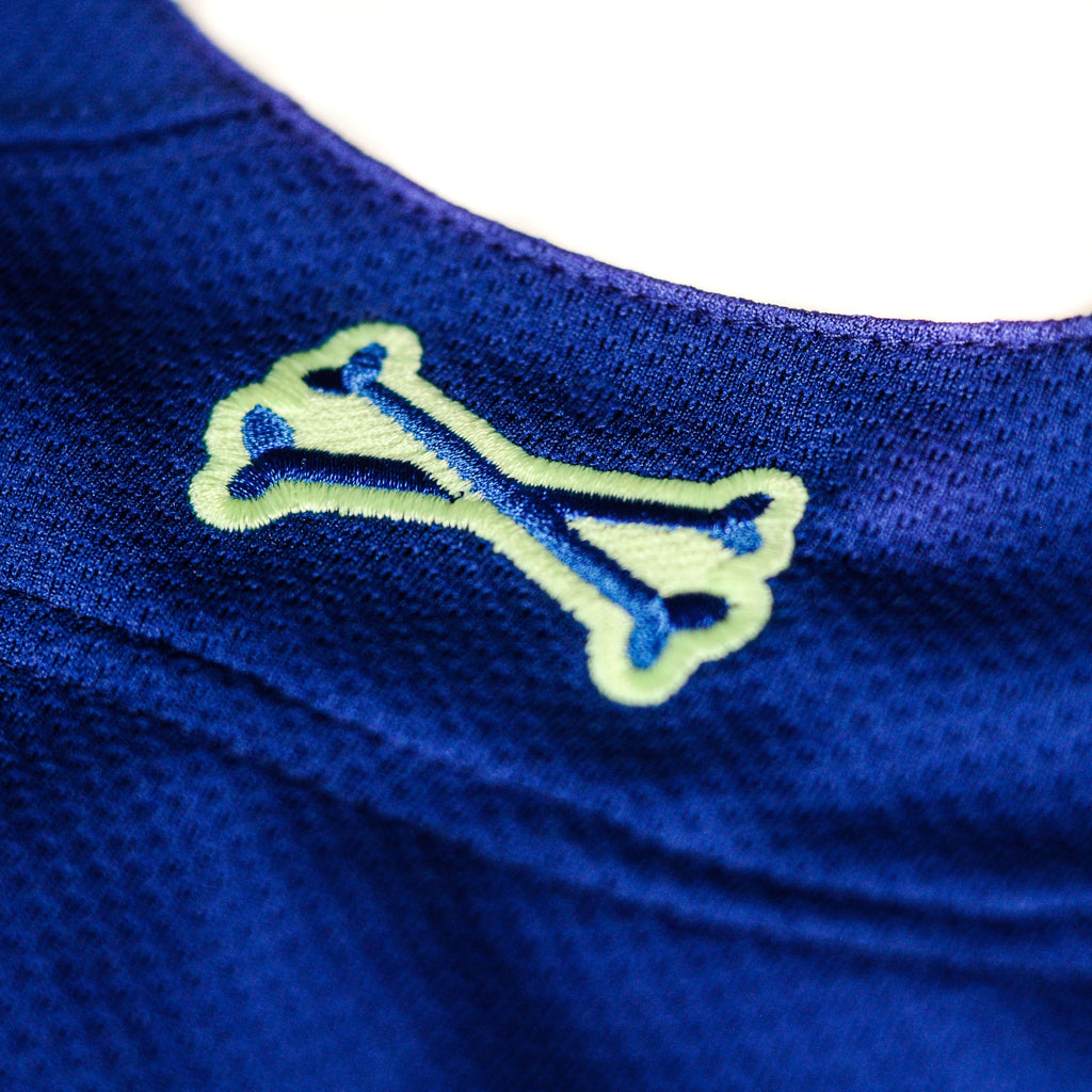 Closeup of rear logo on Super Blue jersey by Crowdead streetwear.
