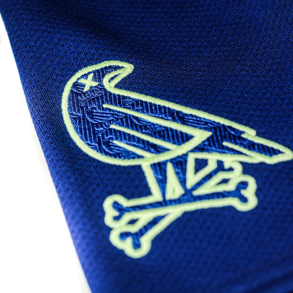 Closeup of sleeve logo on Super Blue jersey by Crowdead streetwear.
